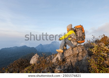 Similar – Image, Stock Photo Tourist with backpack walking among high rocks