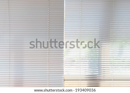 White curtains blinds inside office closed / White curtains blinds