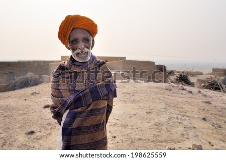 Portrait an old man at Jaisalmer / Old man / JAISALMER,INDIA - DECEMBER 29:Portrait of an old man smiling at Jaisalmer district in  Rajasthan state ,on December 29,2010