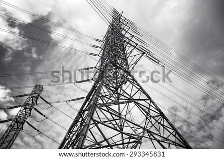 Black and white High voltage AC transmission towers / Electric Power transmission lines