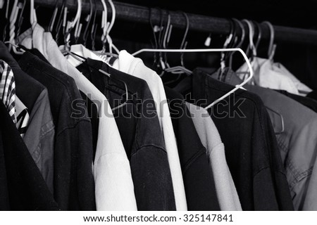 Black and White lot of t-shirt on a hanger / T-shirt on a hanger