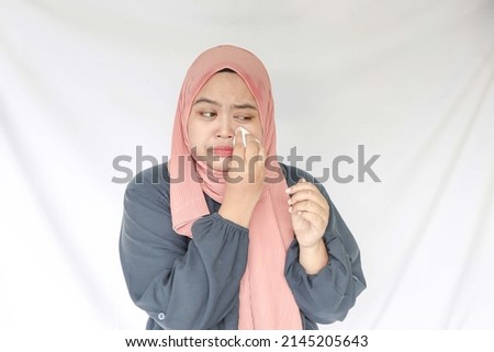 Similar – Image, Stock Photo Tired Arab woman wiping face with towel after training