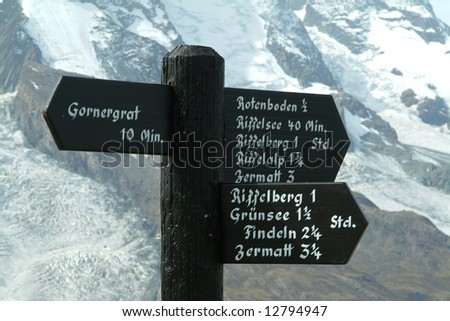 Wooden Signposts on the snow covered Swiss mountains