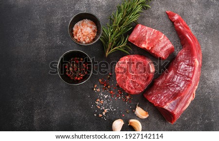 Raw filet mignon steaks with herbs and spices, Raw fresh marbled meat Steak, top view Сток-фото © 