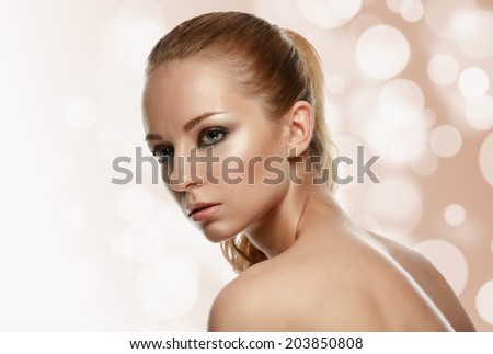 Beautiful Model Woman Face with fashion makeup. Perfect Skin. Professional Make-up. Makeup.
