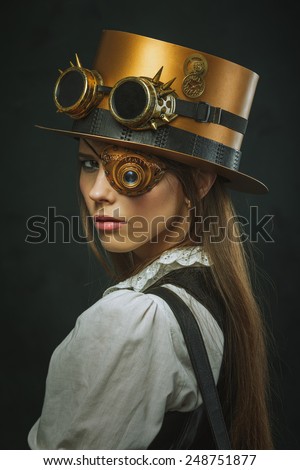 Close-up portrait of a beautiful girl steampunk, hat and eyecup