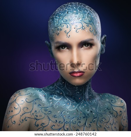 Bald girl with colorful make-up art. Concept - The Snow Queen. Face-art.
