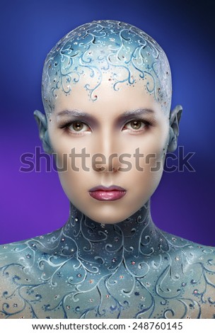 Face-art. Bald girl with colorful make-up art. Concept - The Snow Queen.