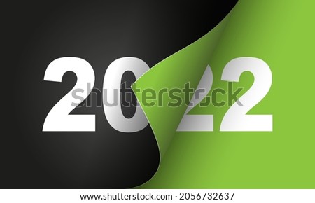 Happy New Year 2022  greeting card design template. End of 2021 and beginning of 2022. The concept of the beginning of the New Year. The calendar page turns over and the new year begins.