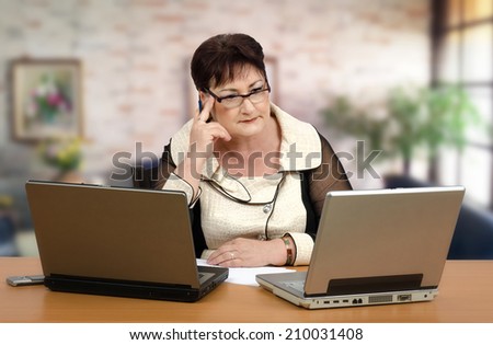 Portrait of middle-aged woman giving individualized on-line tutoring of math