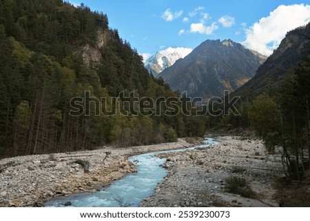 Similar – Foto Bild Von Wasser umgebener steiniger Gipfel in felsigem Tal