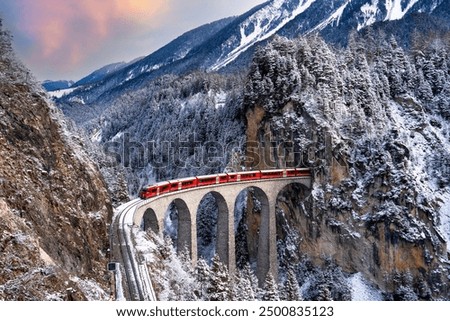 Similar – Foto Bild Ein schneeweisser ICE Zug mit einem dicken roten Streifen verlässt gerade München Hauptbahnhof. In seinen Fenstern spiegelt sich die Bahnhofshalle mit Neonleuchten, das graue Pflaster des Bahnsteigs zeigt einen weißen Streifen