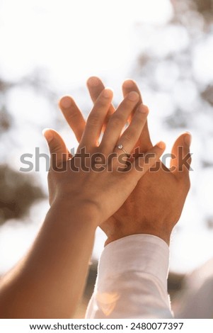 Similar – Image, Stock Photo Couple on their wedding apparel walking by the street