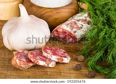 sliced salame on cutting board, Focus area increased by folding multiple photos