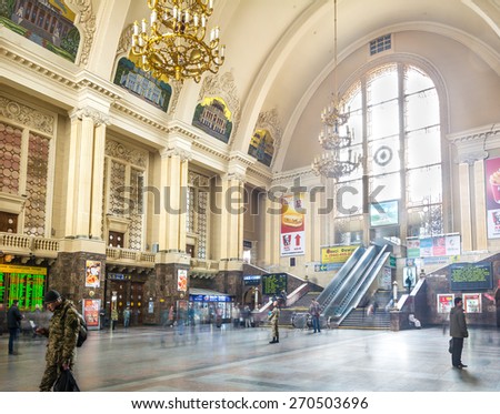 KIEV, UKRAINE - MARCH 27: Volunteer collecting donations for the soldiers inside the main hall of  Kiev Passenger Railway Station ( constructed in 1927-1932 ). Kiev, Ukraine, march 27, 2015, .