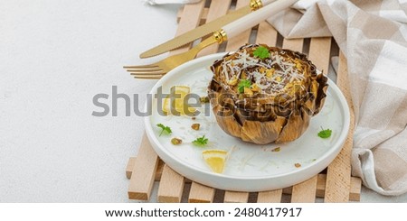 Image, Stock Photo Delicious baked artichokes on black plate