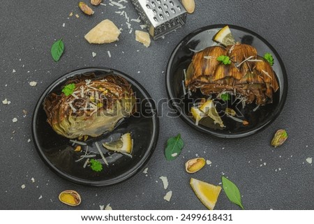 Similar – Image, Stock Photo Delicious baked artichokes on black plate