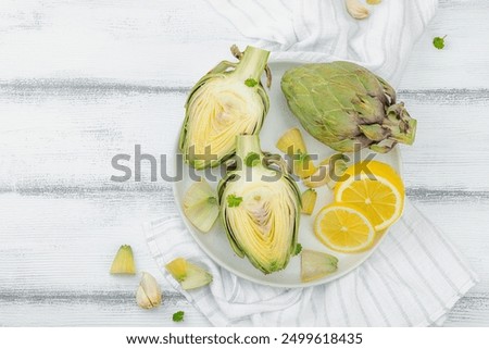 Similar – Image, Stock Photo Fresh green artichokes at the weekly market in Alacati in the province of Izmir at the Aegean Sea in Turkey