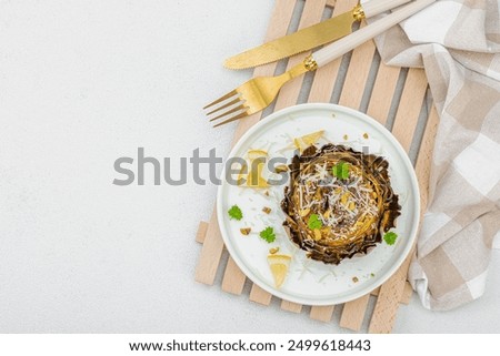 Similar – Image, Stock Photo Delicious baked artichokes on black plate