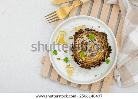 Similar – Image, Stock Photo Delicious baked artichokes on black plate