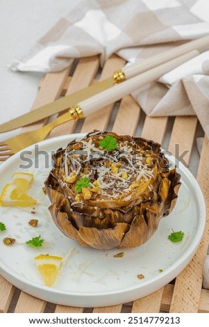 Similar – Image, Stock Photo Delicious baked artichokes on black plate