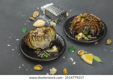 Similar – Image, Stock Photo Delicious baked artichokes on black plate