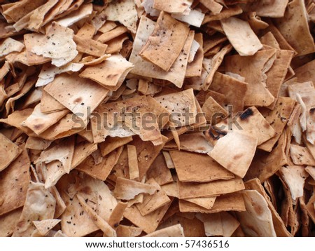Pile of square and broken Pita Chips pattern used for dipping into jam samples