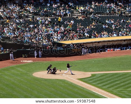 OAKLAND, CA - AUGUST 18: Blue Jays vs. Athletics: Athletics Coco Crisp hits home run ball flies off his bat.  Taken on August 18 2010 at Coliseum in Oakland California.