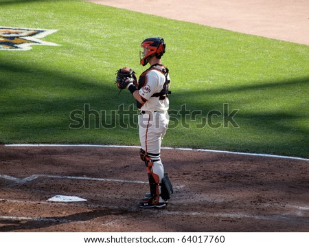 SAN FRANCISCO, CA - OCTOBER 19: Giants vs. Phillies: Catcher Buster Posey stands in catcher gear in between innings game 3 NLCS 2010 October 19, 2010 AT&T Park San Francisco.