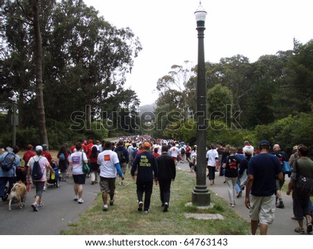 SAN FRANCISCO - JULY 15: long line of people walking during the AIDS Walk 2007 though Golden Gate Park on July 15, 2007 in San Francisco.