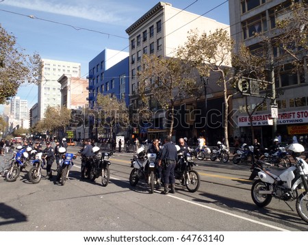 SAN FRANCISCO, CA - NOVEMBER 3: Police officers hang out on market street on dirt bikes keeping the peace after Giants World Series Parade Nov. 3, 2010 San Francisco, CA.