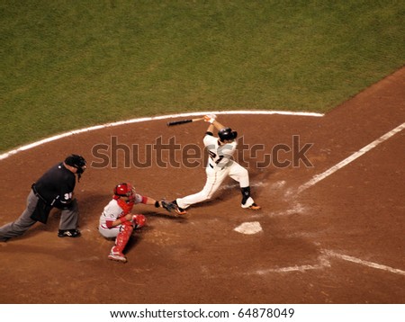 SAN FRANCISCO, CA - OCTOBER 20: Giants vs. Phillies: Freddy Sanchez swings for contact in the batters box with Carlos Ruiz catching game 4 of the NLCS 2010 October 20, 2010 AT&T Park San Francisco.