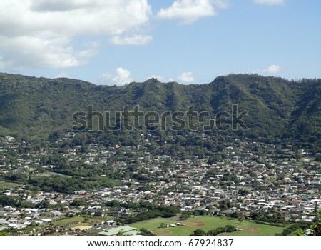 Manoa Valley on the Island of Oahu.  Featuring Baseball fields, houses, school and graveyard.