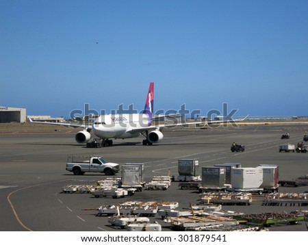 HONOLULU, JUNE 26: Hawaiian Airlines airplanes taxis out to runway as it prepares for take off at Honolulu Internation Airport, Honolulu, Hawaii on June 26 2015.