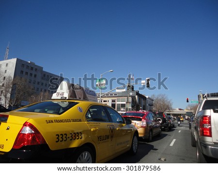 SAN FRANCISCO - JANUARY 27: Cabs, Cars, and Trucks wait in traffic during red light on busy street in San Francisco January 27, 2011.  San Francisco regularly ranks in the top worst traffic in nation.