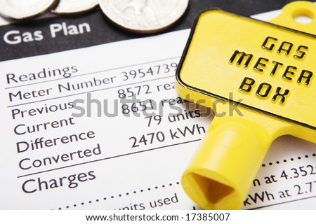 Gas bill with meter key and coins to illustrate rising energy costs
