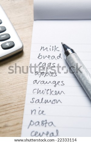 Handwritten Shopping List With Pen And Calculator