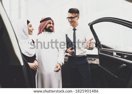 Similar – Image, Stock Photo Young arab woman opening a box with products while smiling, concept retail and buying online