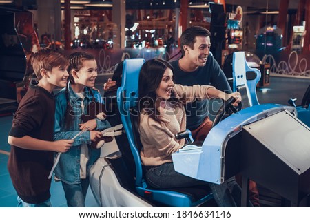 Similar – Image, Stock Photo Joyful couple on playground against grassy field