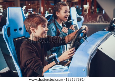 Similar – Image, Stock Photo Joyful couple on playground against grassy field