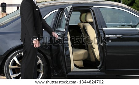 Chauffeur opening car door  ストックフォト © 