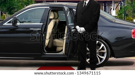 Limo driver standing next to opened car door with red carpet ストックフォト © 