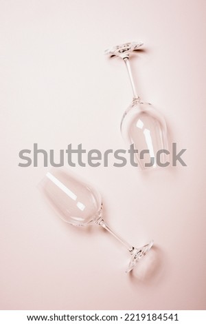 Similar – Image, Stock Photo empty wine glasses. Beautiful new glasses for wine from glass stand in even rows on a wooden table in a restaurant. selective focus