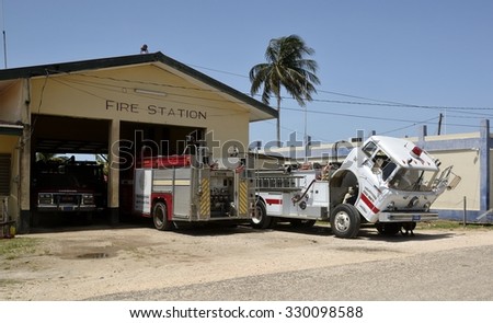 Dangriga, Belize, - May 26, 2015: Fire truck having maintenance work on the frontage of the fire station in Dangriga, Stann Creek District, Belize.