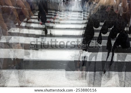 People crossing a road, hurrying, blurred motion