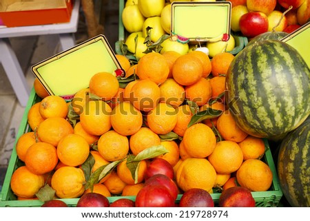 Fresh oranges at market.Very shallow depth of field/Fruits market
