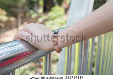 hand holding a hand rail