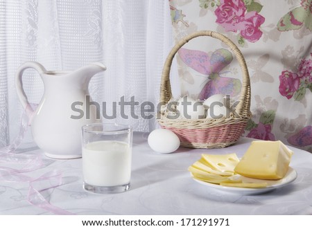 ?lassic rustic still life with eggs, milk and cheese in the style of Provence against the window