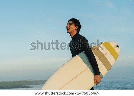 Similar – Image, Stock Photo Man in wetsuit on paddleboard in sea