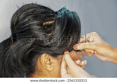 Similar – Image, Stock Photo Professional female master fixing wheel of motorbike